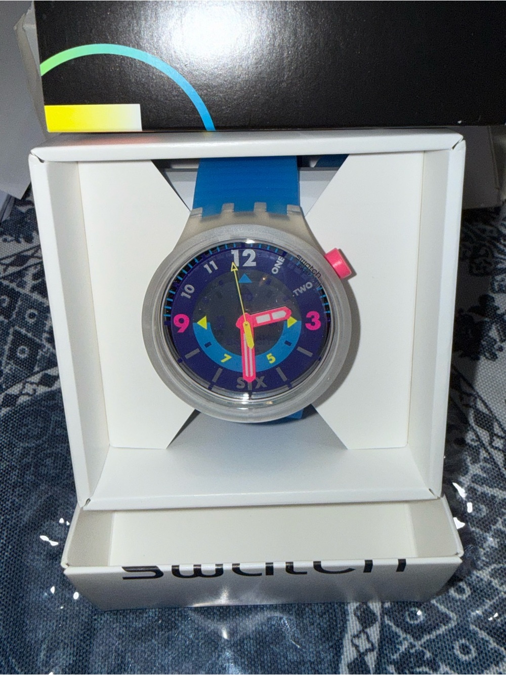 Swatch Blue Watch with Neon Pink and Yellow Accents